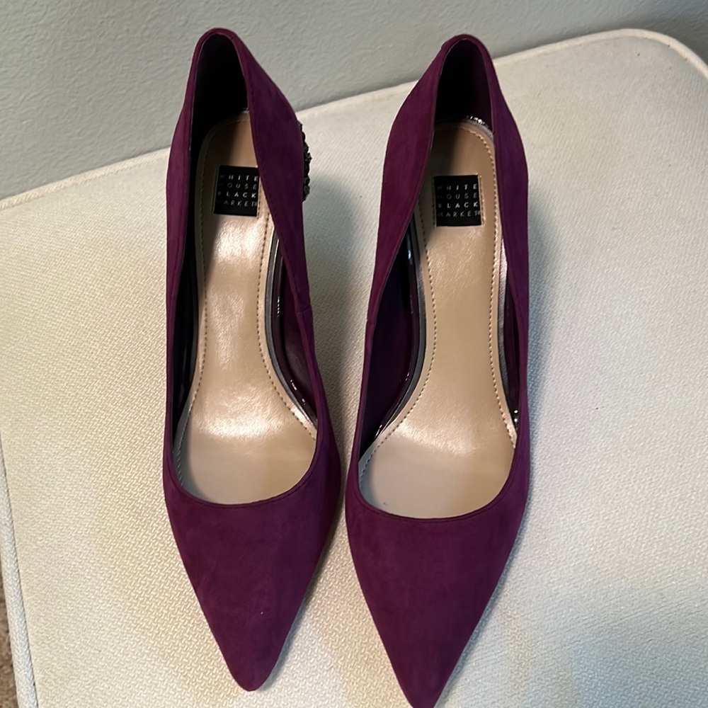 White House Black Market Purple Suede Pumps with purple stones on back.